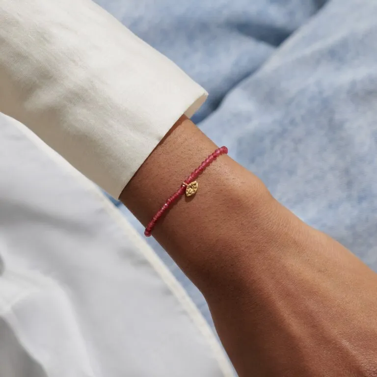 Joma Mini Charms Garnet Eye Gold Bracelet