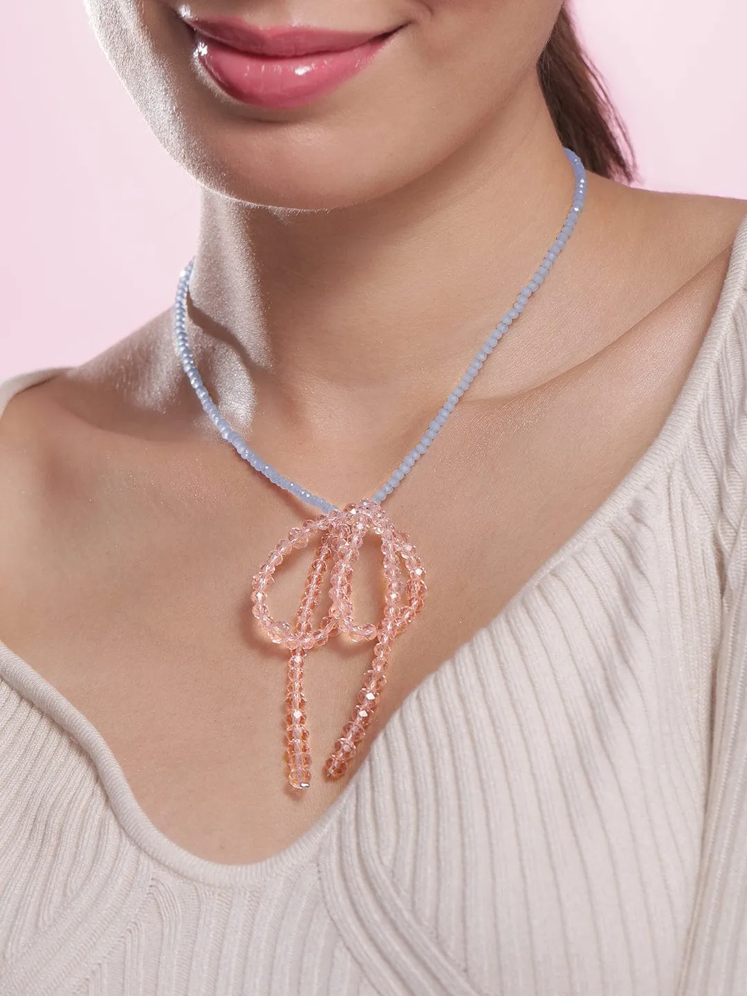 Rubans Rhodium Plated Blue Beaded Necklace with Pink Crystal Bow Pendant