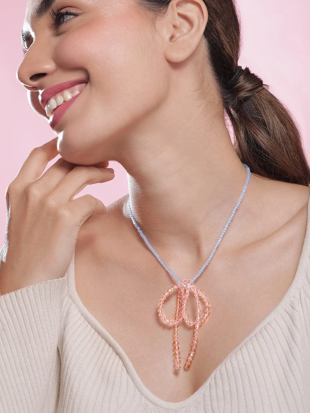 Rubans Rhodium Plated Blue Beaded Necklace with Pink Crystal Bow Pendant