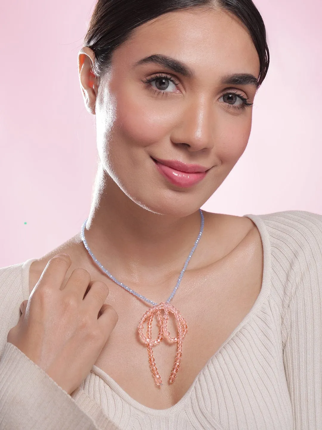 Rubans Rhodium Plated Blue Beaded Necklace with Pink Crystal Bow Pendant